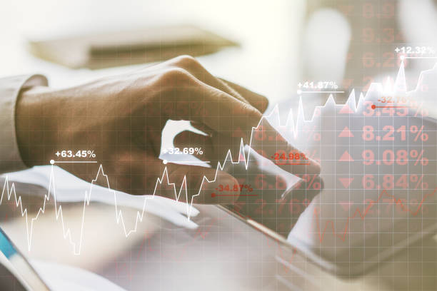 istock Multi exposure of abstract financial diagram and hand working with a digital tablet on background, banking and accounting concept 2154086992
