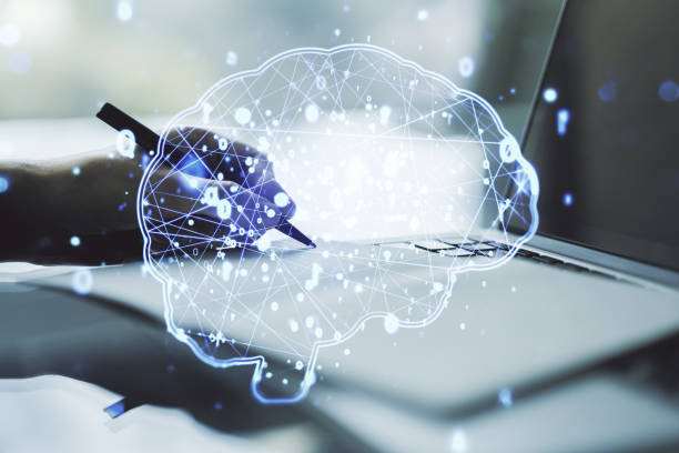 istock Creative artificial Intelligence concept with human brain sketch and hand writing in diary on background with laptop. Double exposure 2154087197