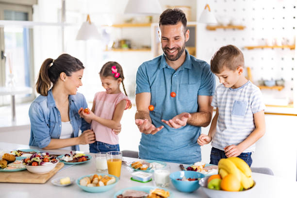 istock Happy family enjoying during breakfast in dining room. 2154087271