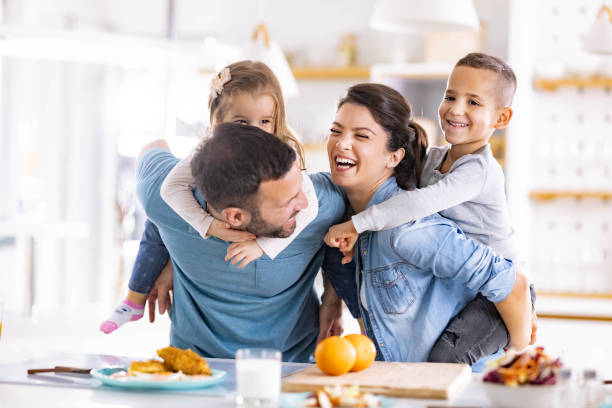 istock Cheerful family having fun in dining room. 2154087595