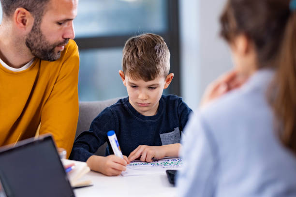 istock Single father and his son having a counseling session. 2154087615