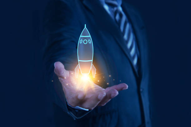 Businessman showing startup business icons on modern virtual interface rocket, idea, growth, digital, technology, concept, unicorn, company, future, success, global