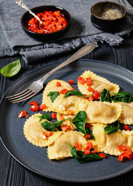 istock italian pasta mezzelune on a plate, top view 2154089623