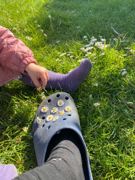 Bare feet and toes of little girl outdoors