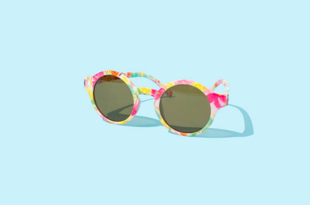 istock Sunglasses on a blue background, copy space. Minimal sunglasses summer sun protection concept. 2154092873