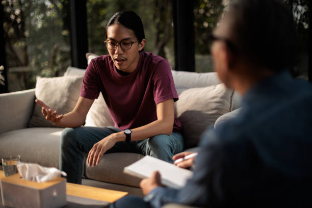 istock Man talking with mental health professional 2154092885