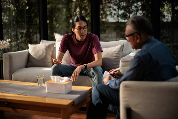 istock Man talking with mental health professional 2154093070