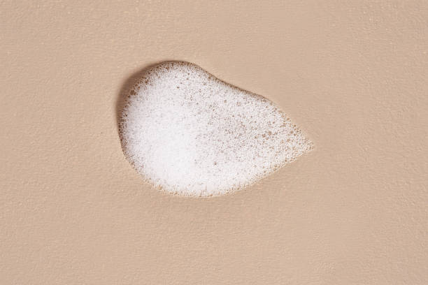 istock Face cleansing mousse sample. White cleanser foam on nude background 2154093311