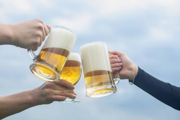 istock Group of friends clinking beer glasses. 2154093400