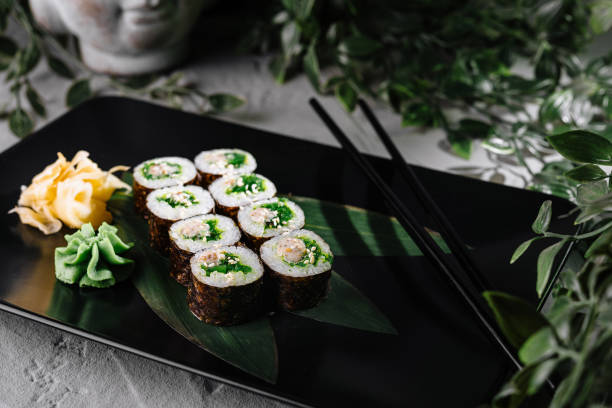 istock Elegant sushi roll display on black plate 2154094338