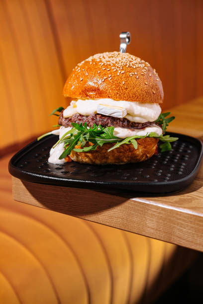 istock Gourmet beef burger with fresh toppings 2154095659