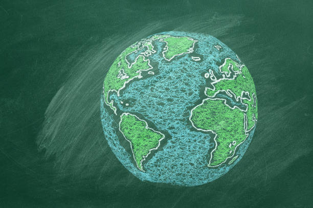 istock Chalk-Drawing of Earth on a Classroom Blackboard During Daytime Lesson 2154096374