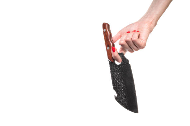 Female hand holds down a knife on white background. High quality photo