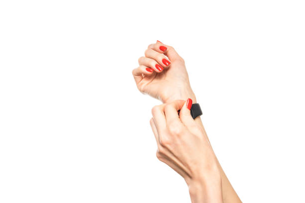 Female hands with white smartwatch isolated on white background. High quality photo
