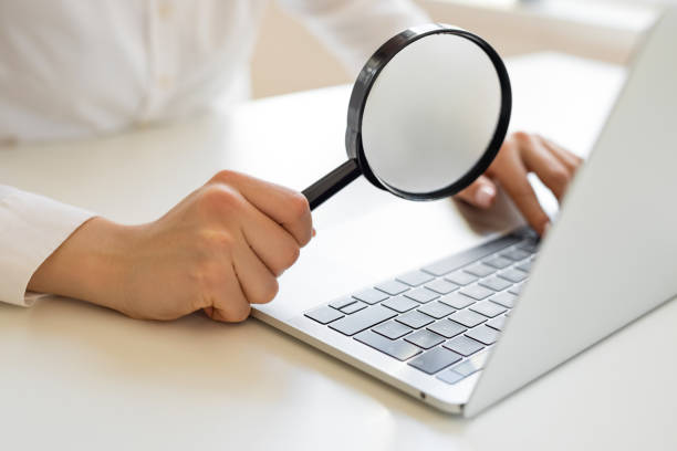 istock Woman use magnifying glass 2154101693