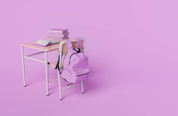 istock School desk with backpack and books on a pink background wit Copy Space 2154102786