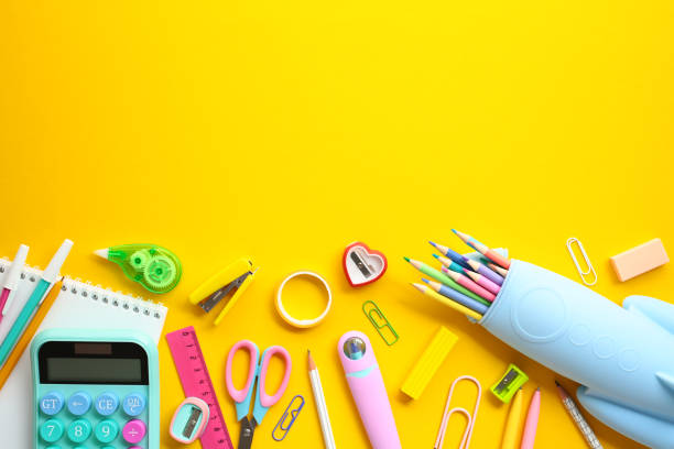 istock Vibrant back-to-school concept with assorted colorful stationery on a bright yellow background. Perfect for educational content marketing or school-related design projects 2154105130
