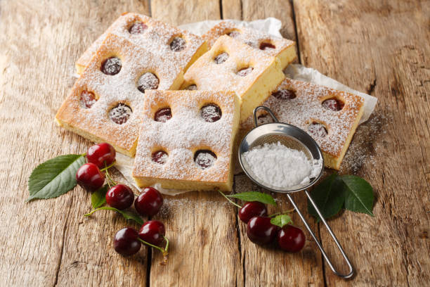 istock Czech bublanina cherry cake with sprinkled with powdered sugar closeup on the parchment. Horizontal 2154105684