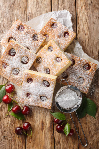 istock Bublanina pie Czech Fruit Sheet Cake closeup on the parchment. Vertical top view 2154105905