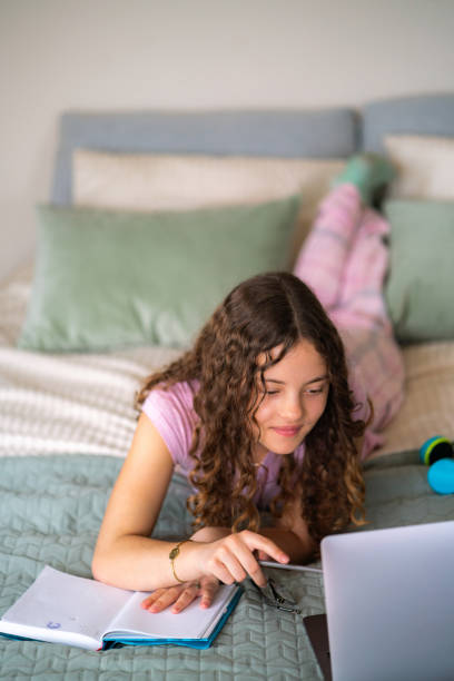 istock Girl studying at home 2154108584