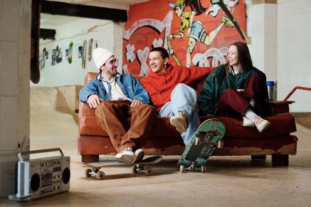 istock Three Friends Hanging Out In Skatepark 2154110271