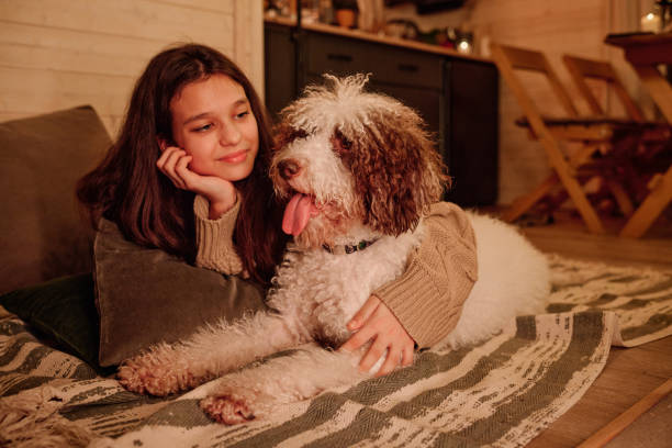 istock Girl And Her Dog Relaxing On Floor 2154110609
