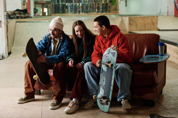 istock Boys And Girl Chatting In Skatepark 2154110663