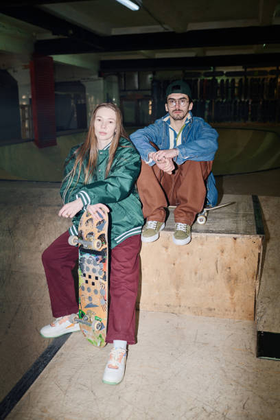 istock Young Man And Woman In Skatepark 2154110730