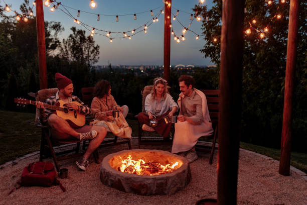 istock Group of friends enjoying an evening by the fire. 2154111258