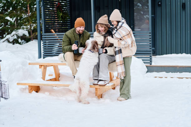 Modern Family Spending Time Outdoors On Winter Day