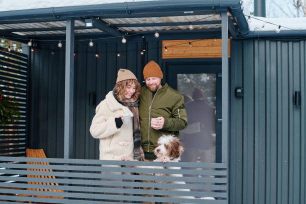 istock Couple With Dog On Winter Day 2154111755
