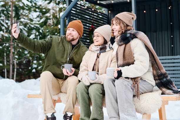istock Family Of Three Taking Selfie Outdoors On Winter Day 2154113218