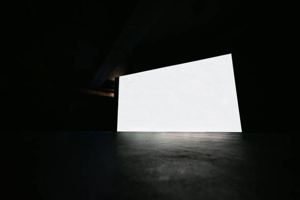 istock White glowing digital cinema screen in dark hall interior with concrete floor and black wall. 2154113234