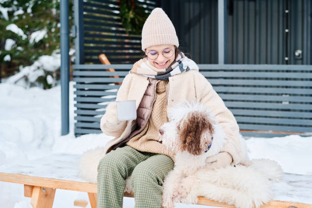 istock Girl And Her Dog On Winter Day 2154113420