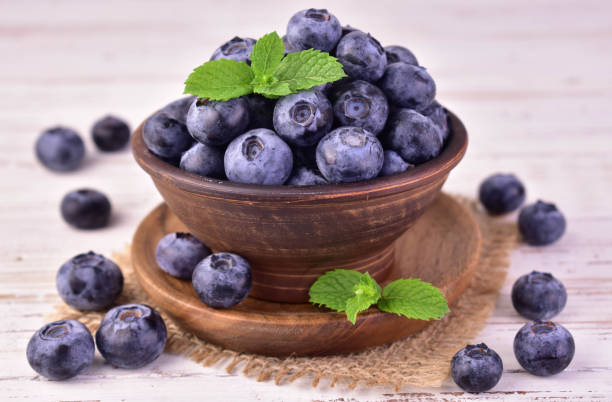 istock Fresh blueberries in a bowl.Close-up. 2154113571