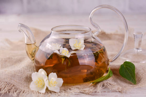 istock Jasmine tea in a transparent teapot and fresh jasmine flowers. 2154113618