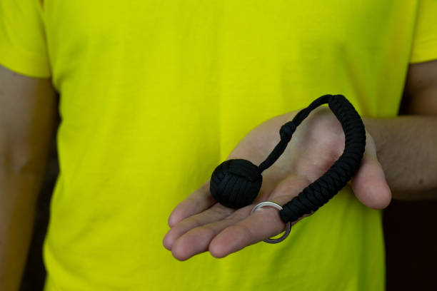istock Compact baton for self-defense, keychain made of paracord 2154113640