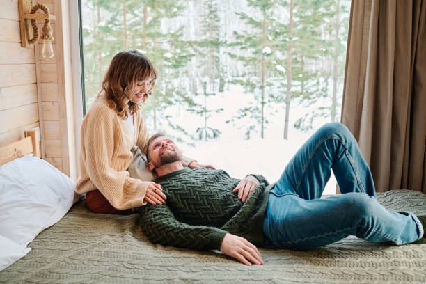 istock Happy Young Couple Relaxing Indoors 2154115987