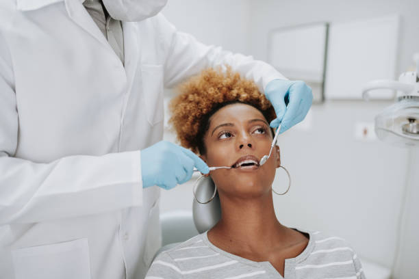 istock woman at the dentist 2154116581
