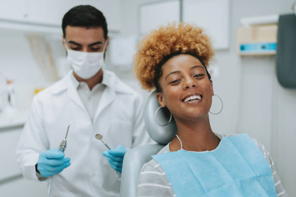 istock woman at the dentist 2154116648