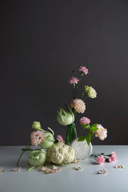 istock unusual composition of flowers, vegetables and cheese 2154117528