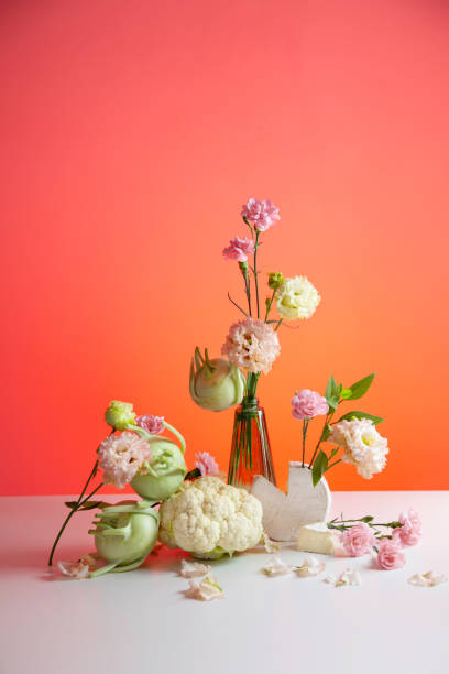 istock unusual composition of flowers, vegetables and cheese 2154117534
