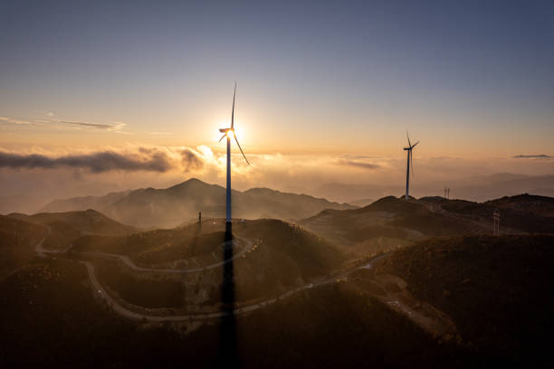 Free Stock Photo of Sunset over rolling hills with wind turbines ...