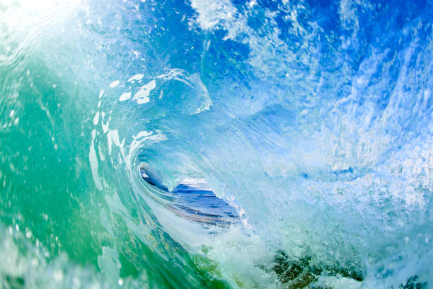 A low wide angle view inside a barrel on a sunny day at Keiki's surf break, North Shore, Oahu.