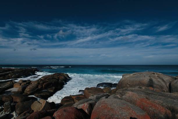 istock Australia's coastline, with massive reefs, cliffs, huge waves, and dark clouds 2154118998