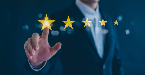 istock Customer service experience and business satisfaction survey, close up  hand using smart phone and give five star symbol to increase rating of product and service concept. 2154119131