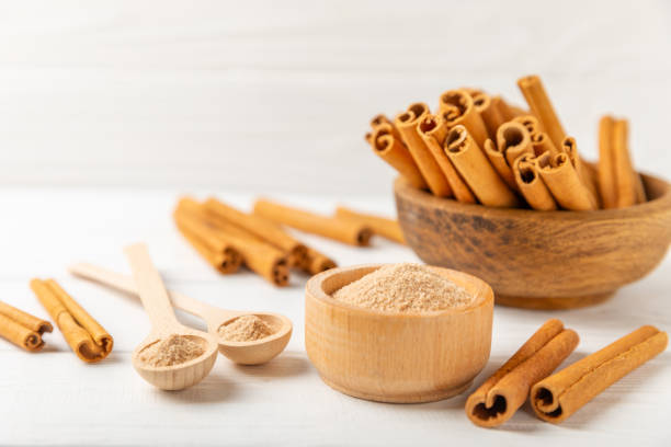 istock Cinnamon sugar on a texture background. Homemade cinnamon sugar in a bowl on background. Brown sugar. Spice mixture for drinks and baking. Place for text. Copy space. 2154120498