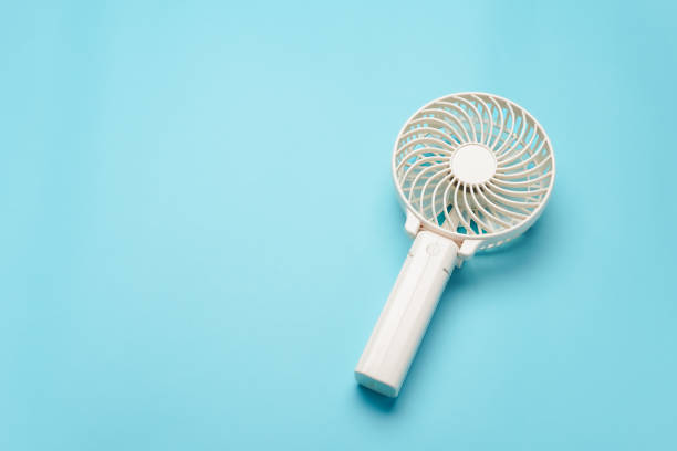 istock Portable electric fan on color background 2154120854