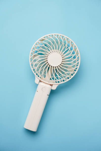 istock Portable electric fan on color background 2154120860