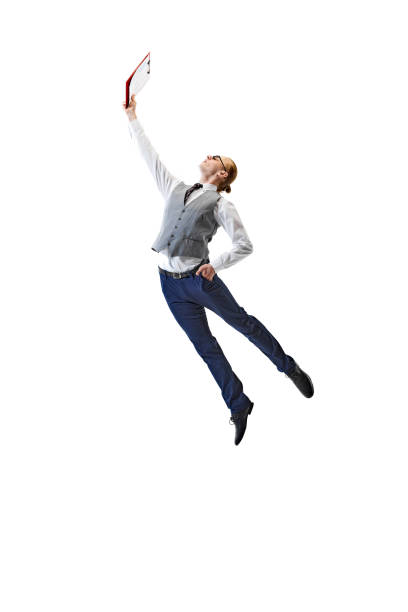 istock Dynamic Achievement. Business professional in formal attire reaches out with folder against white studio background. Modern work life. 2154122284